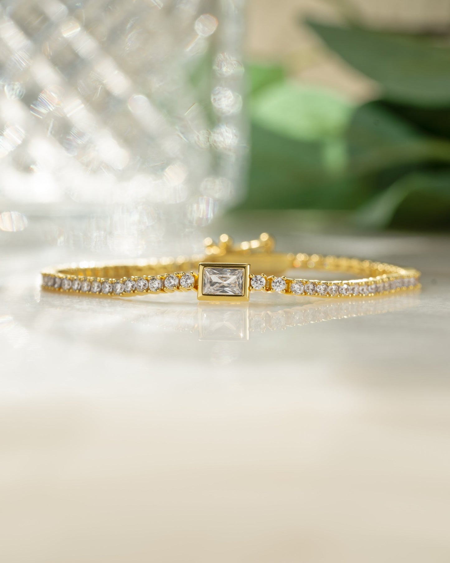 Bezeled Emerald-Cut Charm Tennis Bracelet
