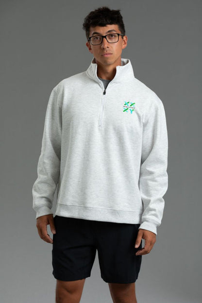 Person wearing a gray half-zip sweatshirt with a logo on a gray background || Light Heather Gray