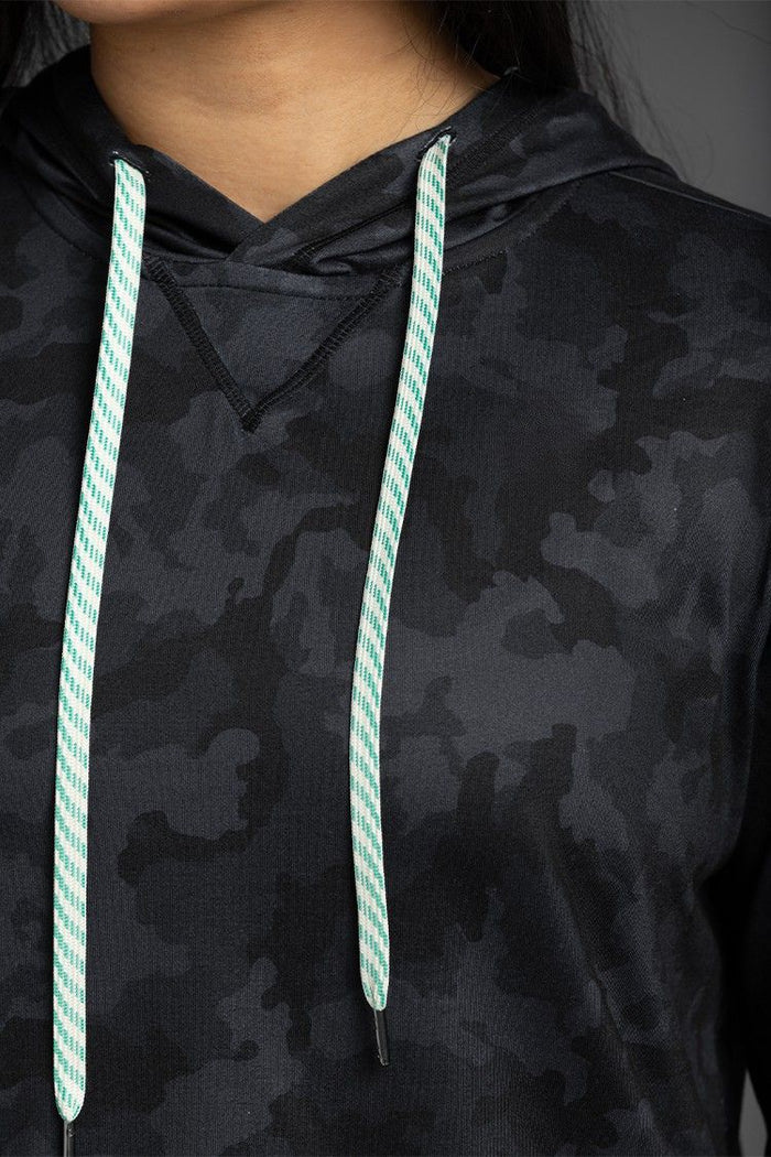 Black camouflage hoodie with green drawstrings on a dark background || Black Camo