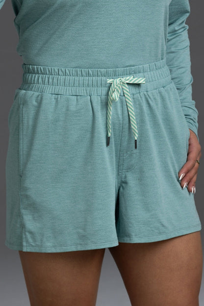 Teal shorts with a drawstring on a plain background || Underseas